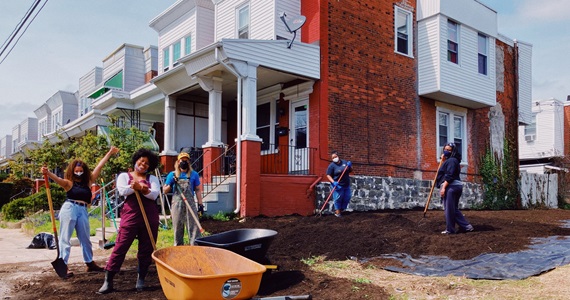Dr. Gripper and community members in Philadelphia preparing a new community garden